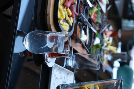 Glasses on a table in a restaurant, close-upの写真素材