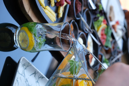 Detail of a glass of mojito cocktail with lemon and mintの写真素材