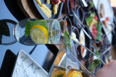 Detail of a glass of cocktail with lemon and mintの写真素材