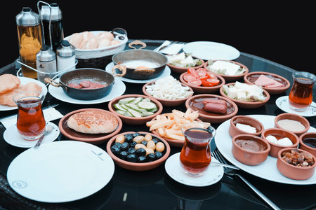 set of different breakfast dishes on a black table, close-upの写真素材