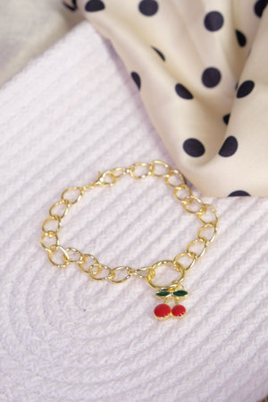 Gold Bracelet with Cherry Charmの写真素材