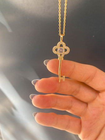 Elegant Gold and Diamond Pendant with Gemstones
