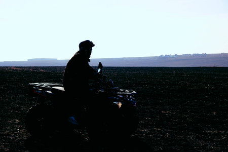 helmet sitting on atv quad bikeの写真素材