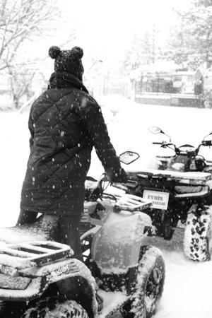 helmet sitting on atv quad bike in mountainsの写真素材