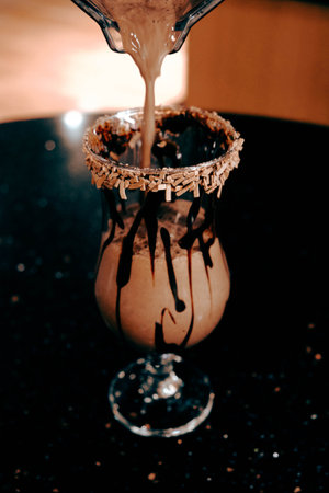 A steaming cup of coffee on the tableの写真素材