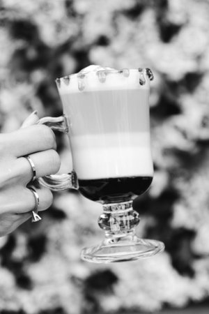 A steaming cup of coffee on the tableの写真素材