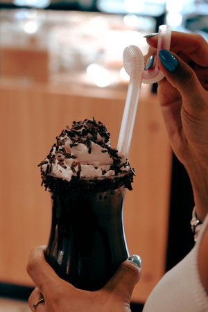 A steaming cup of coffee on the tableの写真素材