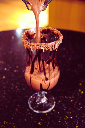 A cozy corner with a steaming cup of coffeeの写真素材