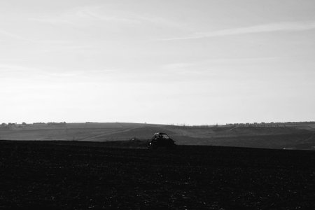 helmet sitting on atv quad bike in mountainsの写真素材