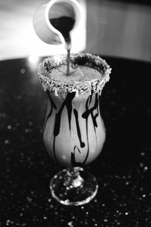 Freshly brewed coffee served in a stylish cupの写真素材