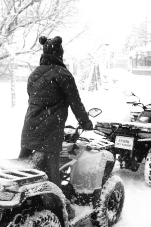 helmet sitting on atv quad bike in mountainsの写真素材