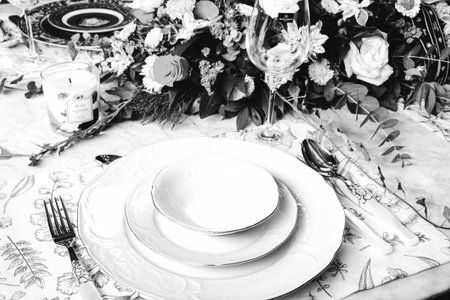 beautiful plate and fresh perfect colorful flowers standing on luxury tableの写真素材