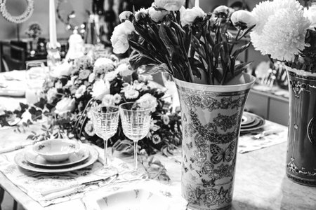beautiful plate and fresh perfect colorful flowers standing on luxury table