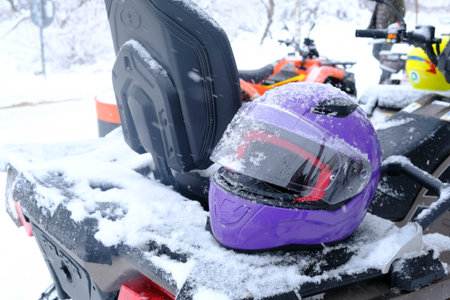 helmet sitting on atv quad bikeの写真素材