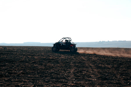 helmet sitting on atv quad bike in mountainsの写真素材