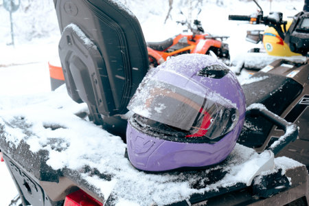 helmet sitting on atv quad bikeの写真素材
