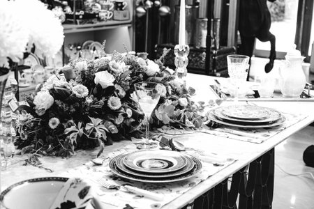 beautiful plate and fresh perfect colorful flowers standing on luxury tableの写真素材
