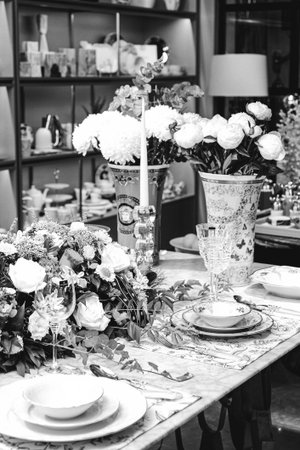 beautiful plate and fresh perfect colorful flowers standing on luxury tableの写真素材