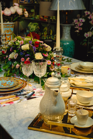 beautiful plate and fresh perfect colorful flowers standing on luxury tableの写真素材