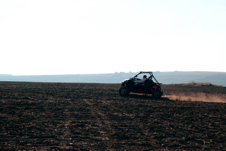 helmet sitting on atv quad bike in mountainsの写真素材