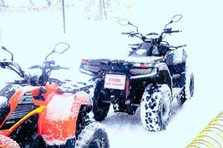 helmet sitting on atv quad bike in mountainsの写真素材
