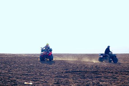 helmet sitting on atv quad bike in mountainsの写真素材