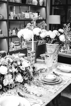 beautiful plate and fresh perfect colorful flowers standing on luxury table