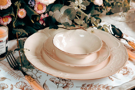 beautiful plate and fresh perfect colorful flowers standing on luxury table