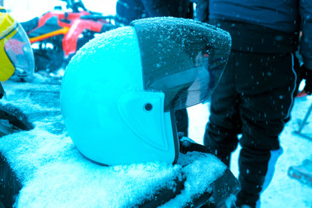 helmet sitting on atv in mountainsの写真素材