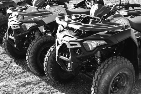 helmet sitting on atv quad bike in mountainsの写真素材