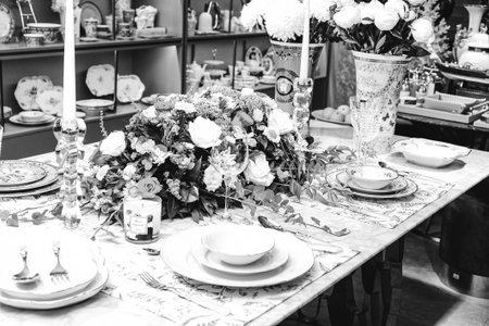 beautiful plate and fresh perfect colorful flowers standing on luxury tableの写真素材
