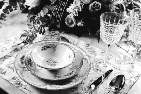 beautiful plate and fresh perfect colorful flowers standing on luxury table