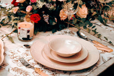 beautiful plate and fresh perfect colorful flowers standing on luxury table