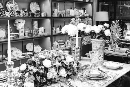 beautiful plate and fresh perfect colorful flowers standing on luxury tableの写真素材