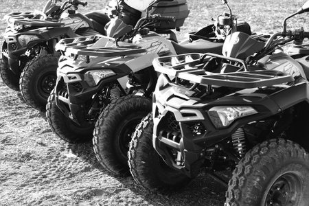 helmet sitting on atv quad bike in mountainsの写真素材