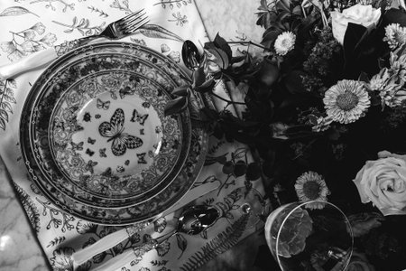 beautiful plate and fresh perfect colorful flowers standing on luxury table