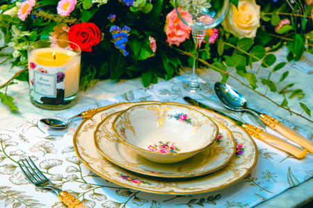 beautiful plate and fresh perfect colorful flowers standing on luxury table