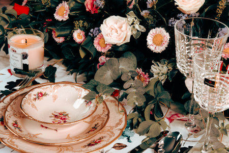 beautiful plate and fresh perfect colorful flowers standing on luxury tableの写真素材