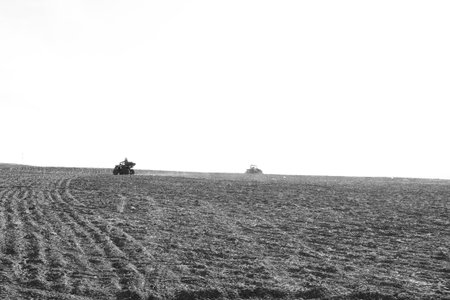helmet sitting on atv quad bike in mountainsの写真素材