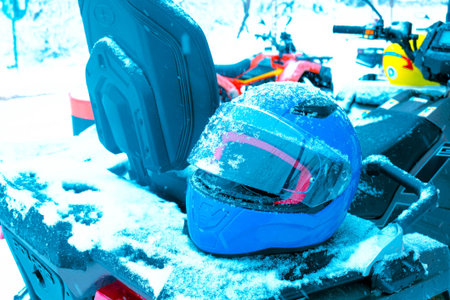 helmet sitting on atv quad bike in mountains
