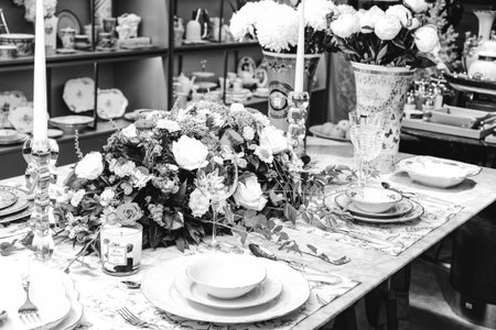 beautiful plate and fresh perfect colorful flowers standing on luxury tableの写真素材