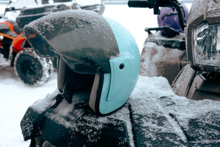 helmet sitting on atv in mountainsの写真素材