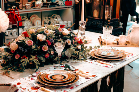 beautiful plate and fresh perfect colorful flowers standing on luxury tableの写真素材