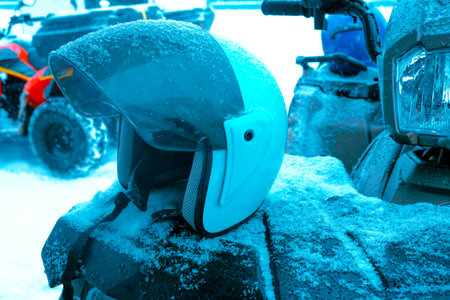 helmet sitting on atv quad bikeの写真素材
