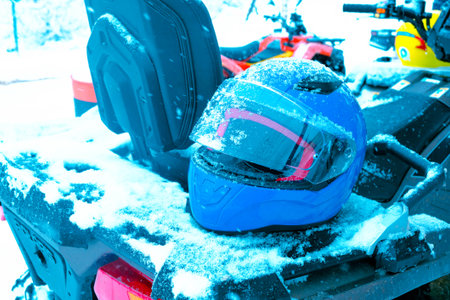 helmet sitting on atv quad bikeの写真素材