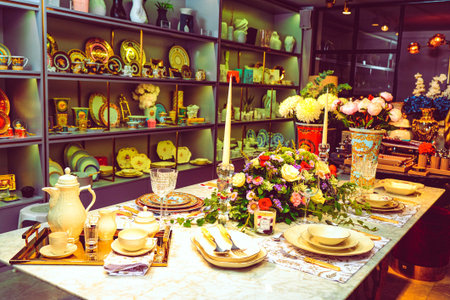 beautiful plate and fresh perfect colorful flowers standing on luxury table