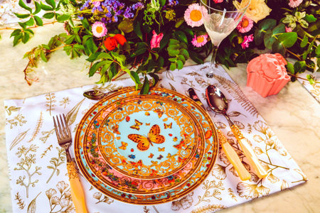 beautiful plate and fresh perfect colorful flowers standing on luxury tableの写真素材