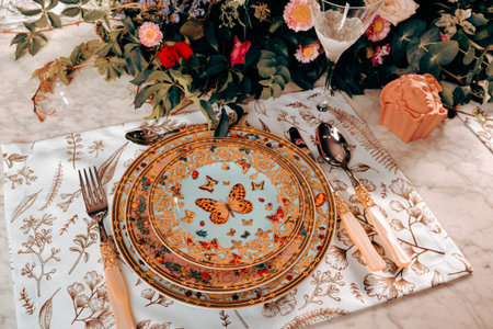 beautiful plate and fresh perfect colorful flowers standing on luxury table