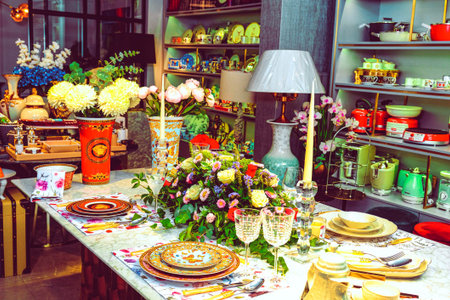 beautiful plate and fresh perfect colorful flowers standing on luxury table