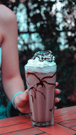 Freshly prepared coffee beverage served in a stylish cupの写真素材